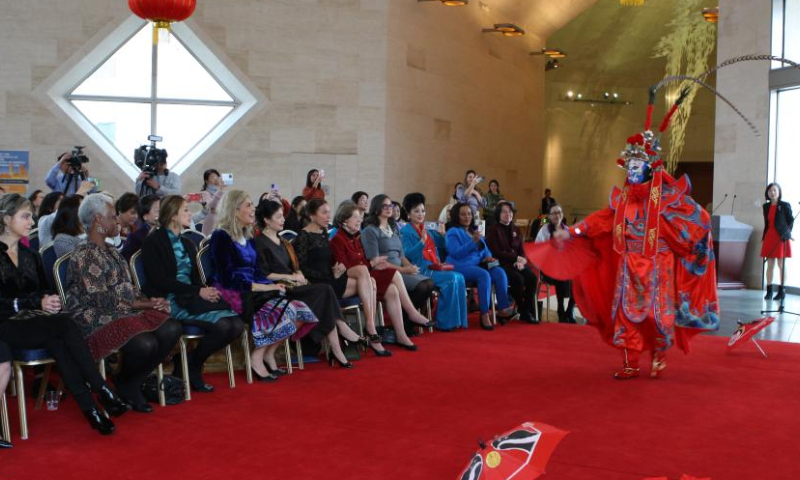 Guests enjoy a Sichuan opera face-changing performance at the Chinese Embassy in the United States in Washington, D.C., on Dec. 20, 2024. The Chinese Embassy in the United States recently hosted a cultural event themed Celebrating the Winter Solstice: Sharing Warmth and Culture. Held on Dec. 20, the celebratory event was attended by more than 50 guests from various sectors of U.S. society and foreign diplomatic missions in Washington, D.C. (Xinhua/Yan Liang)