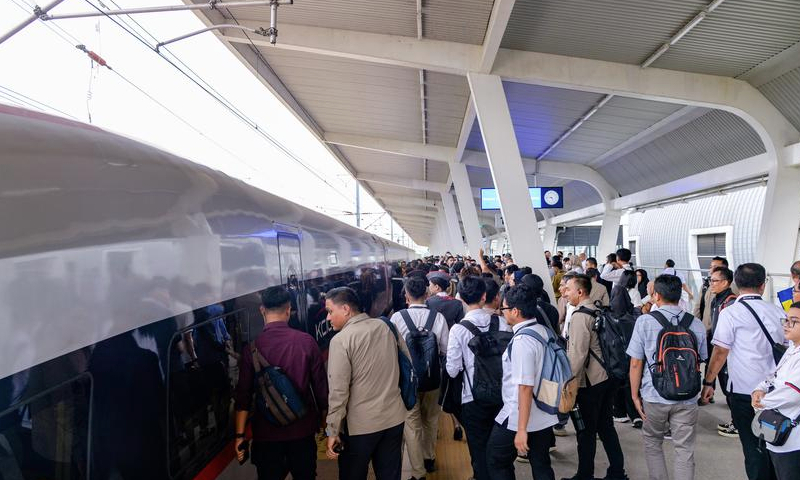 Passengers wait for a high-speed electrical multiple unit (EMU) train on the platform of Karawang Station of Jakarta-Bandung High-Speed Railway in West Java, Indonesia, Dec. 24, 2024. (Xinhua/Xu Qin)