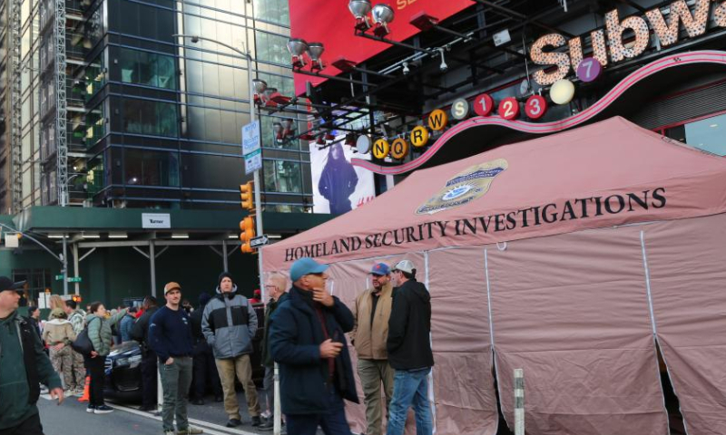 U.S. homeland security officials work outside a subway entrance in Times Square in New York City, the United States, on Dec. 31, 2024. New York State Governor Kathy Hochul on Monday announced increased security measures statewide to ensure public safety during holiday celebrations. (Xinhua/Liu Yanan)