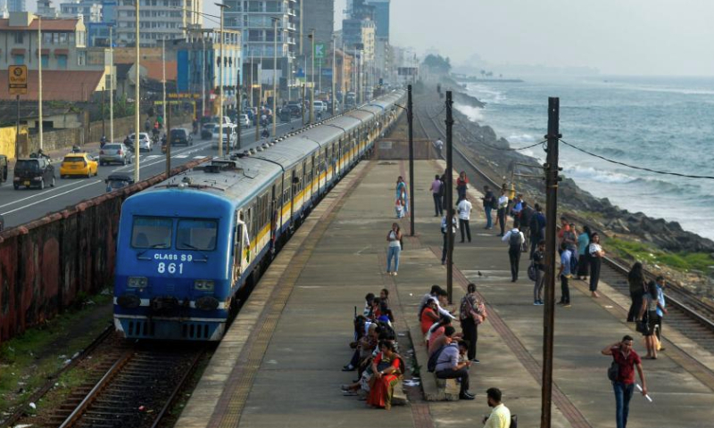 This photo taken on Dec. 18, 2024 shows a train by the sea in Colombo, Sri Lanka.

The coastal railway line, located on the west coast of Sri Lanka and close to the Indian Ocean, is a major railway line in this island country. It is also a famous tourist attraction, where the straight coastline, the carriages without doors, and the beautiful sea view throughout the journey allow people to get the unique Ceylon-style experience. (Photo by Gayan Sameera/Xinhua)