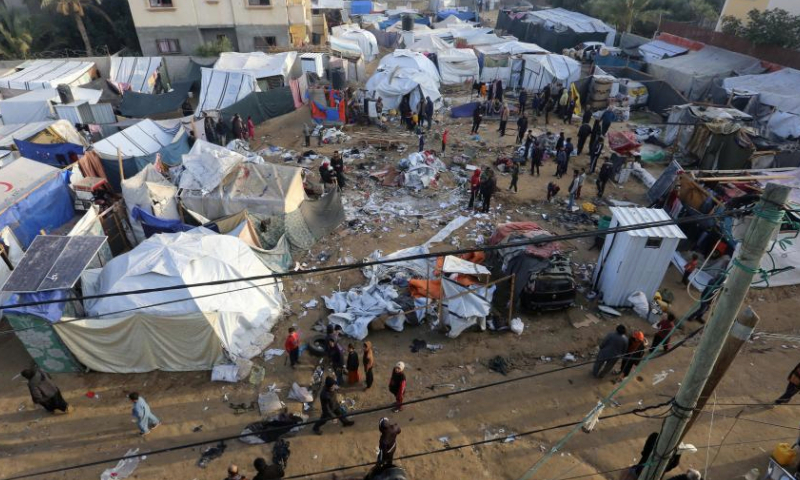 People are seen at the site of destroyed tents after an Israeli bombardment in Deir al-Balah, central Gaza Strip, on Jan. 4, 2025.

The Palestinian death toll from ongoing Israeli attacks in the Gaza Strip has risen to 45,717, the Gaza-based health authorities said in a statement on Saturday. (Photo by Rizek Abdeljawad/Xinhua)