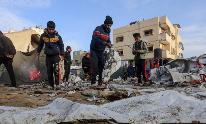 People are seen at the site of destroyed tents after an Israeli bombardment in Deir al-Balah, central Gaza Strip, on Jan. 4, 2025.

The Palestinian death toll from ongoing Israeli attacks in the Gaza Strip has risen to 45,717, the Gaza-based health authorities said in a statement on Saturday. (Photo by Rizek Abdeljawad/Xinhua)