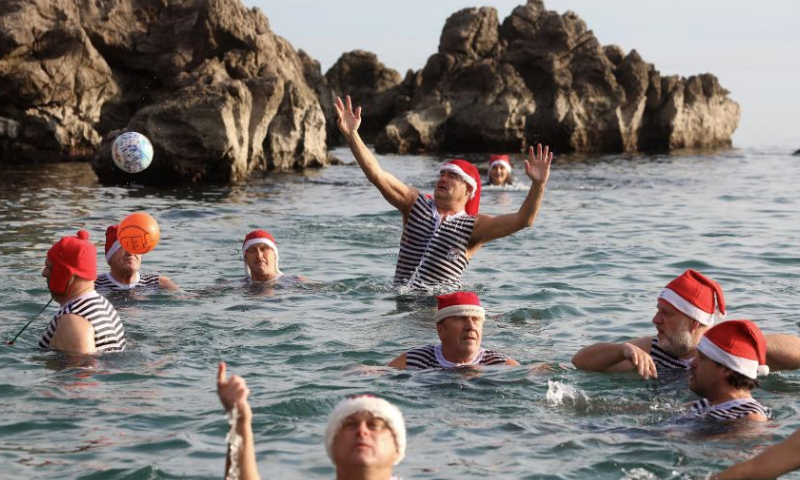 People take part in New Year's Day swimming in Croatia