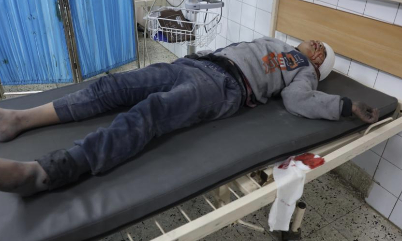 An injured child is treated at a hospital following an Israeli airstrike on the headquarters of the Civil Defense in Gaza City, on Jan. 1, 2025. The Palestinian death toll from ongoing Israeli attacks in the Gaza Strip has risen to 45,553, Gaza-based health authorities said in a statement on Wednesday. (Photo by Abdul Rahman Salama/Xinhua)