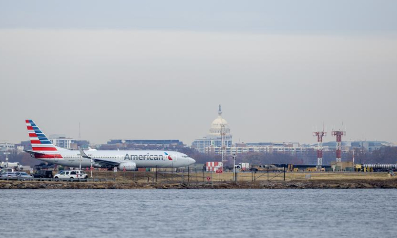 An American Airlines aircraft moves along the tarmac at Ronald Reagan Washington National Airport in Arlington, Virginia, the United States, on Dec. 24, 2024. American Airlines briefly grounded flights nationwide on Tuesday due to a technical issue just as the Christmas travel season kicks into overdrive and winter weather is threatening more potential problems for those planning to fly or drive in the United States. American flights were cleared to fly by federal regulators about one hour after a national ground stop order was issued by the Federal Aviation Administration. (Xinhua/Hu Yousong)