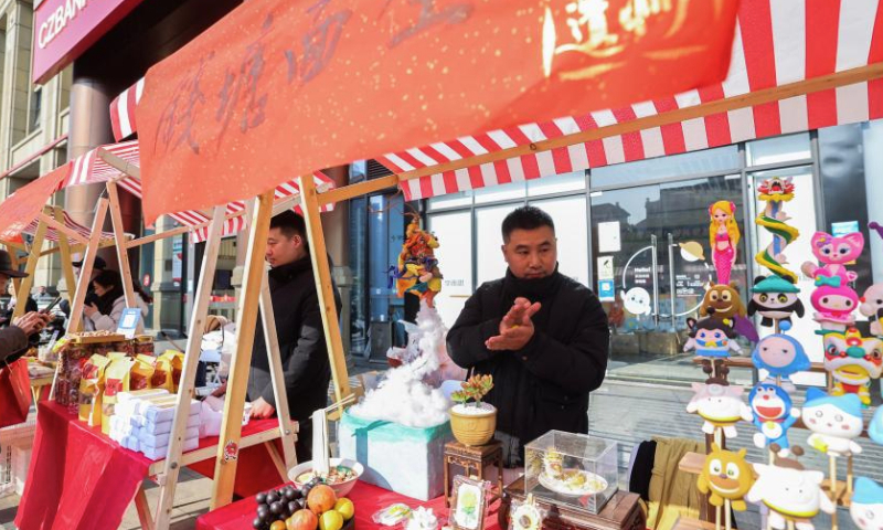 Dough sculpture works are presented at a booth at a New Year fair in Shangcheng District of Hangzhou, east China's Zhejiang Province, Dec. 31, 2024. The fair opened here on Tuesday, with themed sections showcasing intangible cultural heritage, cultural and creative products, folk custom, and folk arts native to Hangzhou. Specialty food and deli are also made available there, adding a festive atmosphere to the city. (Xinhua/Xu Yu)