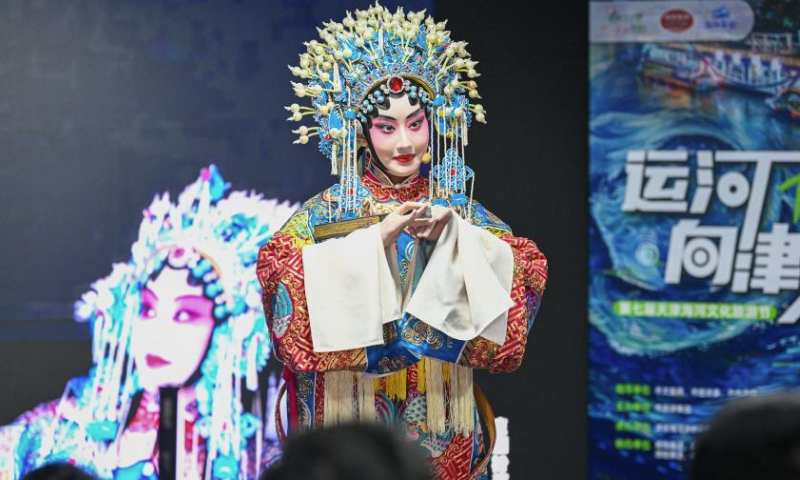 An actress performs traditional opera for passengers aboard a sightseeing boat on Haihe River in Tianjin, north China, March 28, 2024.

Dec. 23 this year marks the 620th anniversary of establishment of the Tianjin City, which now stands as a tremendous attraction for tourists from home and abroad. (Xinhua/Sun Fanyue)