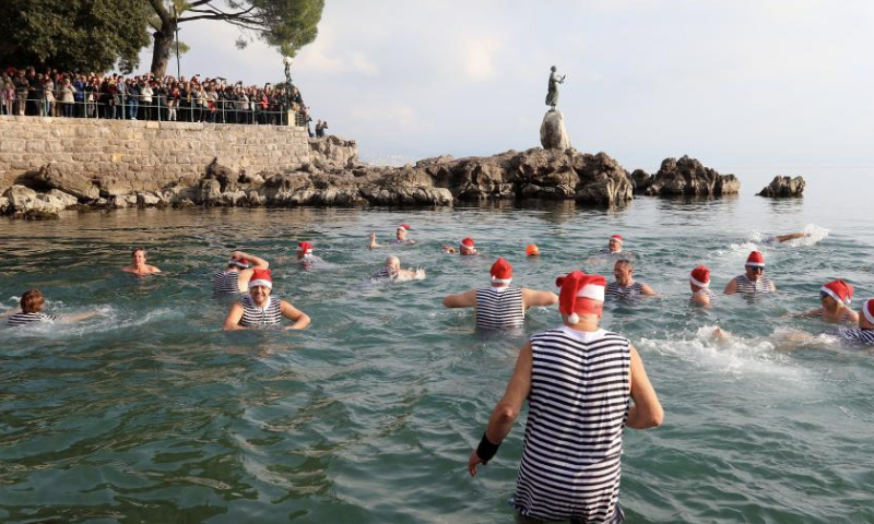 People take part in the traditional New Year's Day swimming in the sea in Opatija, Croatia, on Jan. 1, 2025. (Goran Kovacic/PIXSELL via Xinhua)