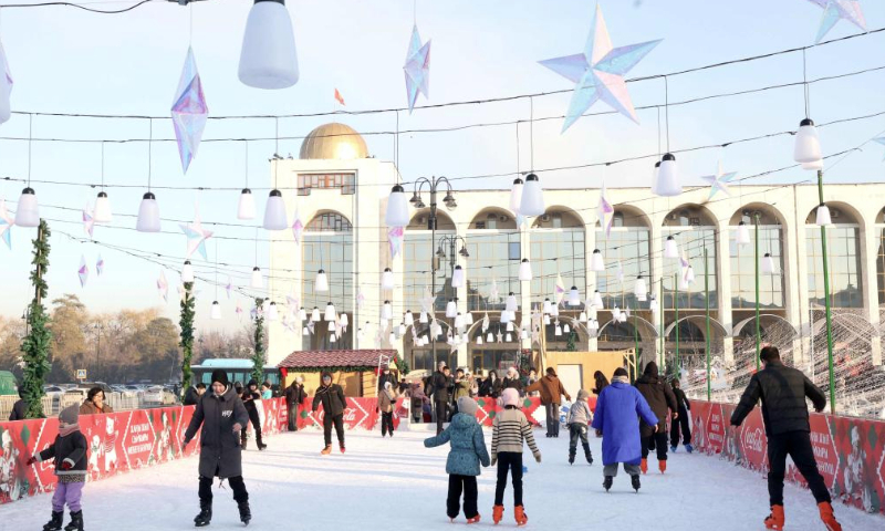 People skate at Ala Too Square during a New Year event in Bishkek, Kyrgyzstan, Dec. 25, 2024. (Photo by Roman Gainanov/Xinhua)