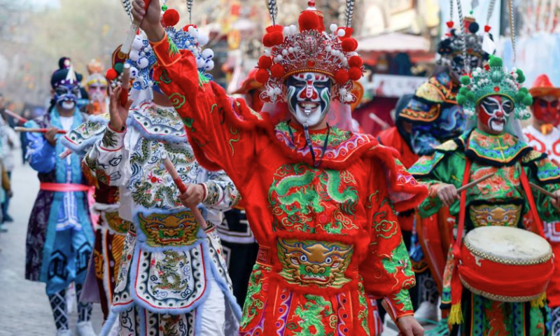 Fork artists perform in the old city of Kashgar, northwest China's Xinjiang Uygur Autonomous Region, on Jan. 1, 2025. People across China enjoy themselves in various activities, celebrating the first day of 2025. (Xinhua/Wang Fei)