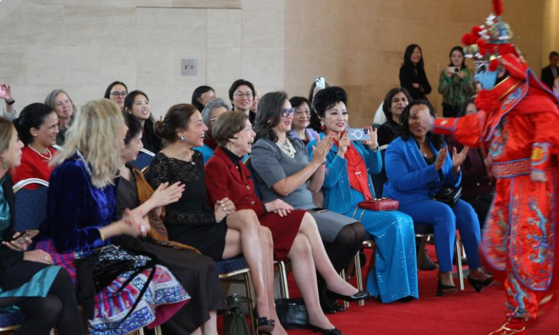 Guests enjoy a Sichuan opera face-changing performance at the Chinese Embassy in the United States in Washington, D.C., on Dec. 20, 2024. The Chinese Embassy in the United States recently hosted a cultural event themed Celebrating the Winter Solstice: Sharing Warmth and Culture. Held on Dec. 20, the celebratory event was attended by more than 50 guests from various sectors of U.S. society and foreign diplomatic missions in Washington, D.C. (Xinhua/Yan Liang)