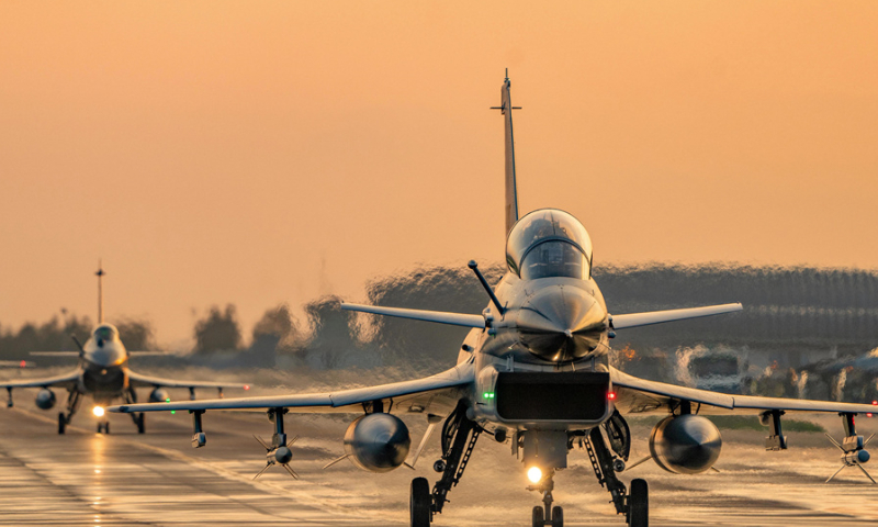 J-10 fighter jets attached to an aviation brigade with the air force under the Chinese PLA Southern Theater Command taxi on the runway during a flight training exercise in late November, 2024. (eng.chinamil.com.cn/Photo by Wang Guoyun)