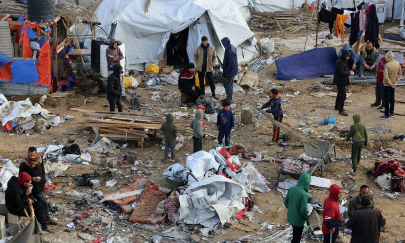 People are seen at the site of destroyed tents after an Israeli bombardment in Deir al-Balah, central Gaza Strip, on Jan. 4, 2025.

The Palestinian death toll from ongoing Israeli attacks in the Gaza Strip has risen to 45,717, the Gaza-based health authorities said in a statement on Saturday. (Photo by Rizek Abdeljawad/Xinhua)