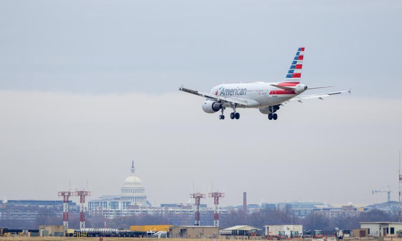 An American Airlines aircraft makes its final approach to Ronald Reagan Washington National Airport in Arlington, Virginia, the United States, on Dec. 24, 2024. American Airlines briefly grounded flights nationwide on Tuesday due to a technical issue just as the Christmas travel season kicks into overdrive and winter weather is threatening more potential problems for those planning to fly or drive in the United States. American flights were cleared to fly by federal regulators about one hour after a national ground stop order was issued by the Federal Aviation Administration. (Xinhua/Hu Yousong)