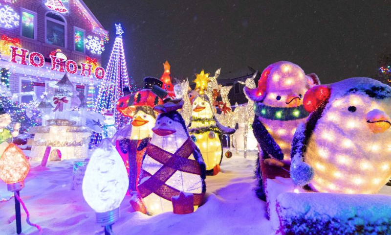 Colorful lights and decorations are seen outside a residential house in Mississauga, Ontario, Canada, on Dec. 23, 2024. (Photo by Zou Zheng/Xinhua)