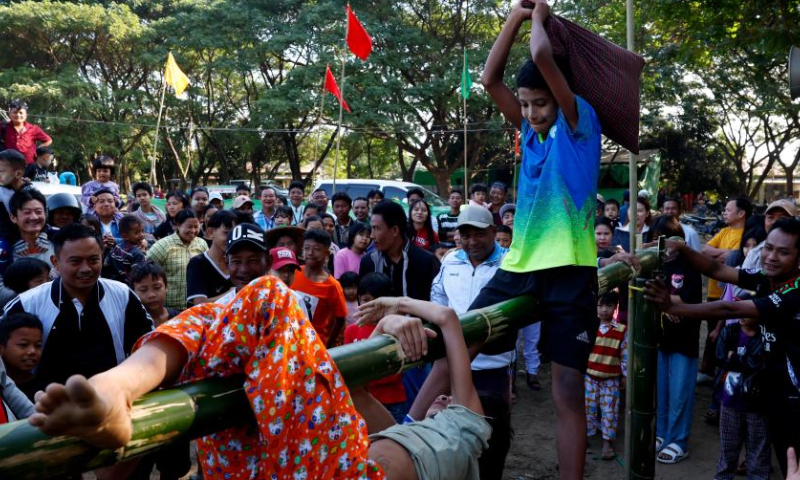 Children compete in a pillow-fighting game during an event marking the 77th Anniversary of Independence Day in Nay Pyi Taw, Myanmar, Jan. 4, 2025. Myanmar on Saturday celebrated the 77th Anniversary of Independence Day with various events being held across the country. (Xinhua/Myo Kyaw Soe)