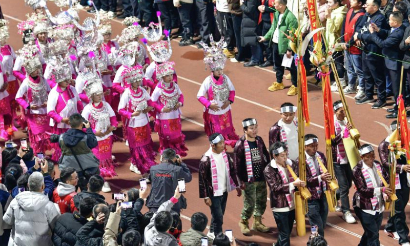 Cheering squads parade during the opening ceremony of the Village Super League 2025 in Rongjiang County of southwest China's Guizhou Province, Jan. 4, 2025. The Village Super League, an amateur football tournament dubbed Cun Chao by Chinese netizens, started its third season on Saturday. More than 3,000 players of 108 teams participate in the games this year. (Xinhua/Yang Wenbin)