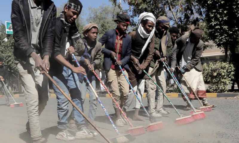 Yemeni locals participate in a comprehensive cleaning campaign launched to welcome the new year in Sanaa, Yemen, on Jan. 1, 2025. (Photo by Mohammed Mohammed/Xinhua)