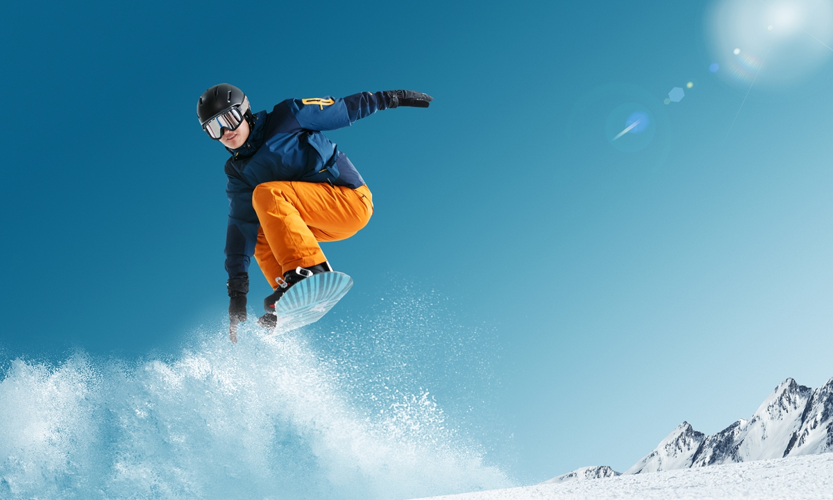 A man takes a jump on a snowboard. Photo: VCG