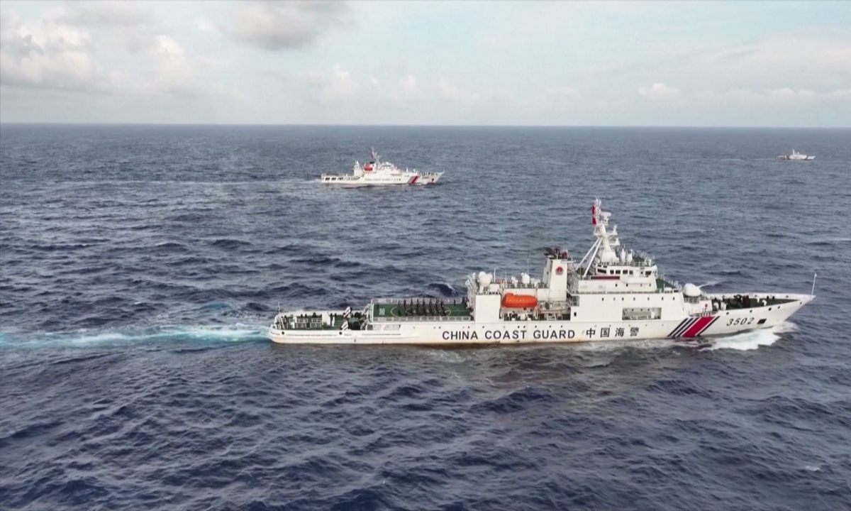 The China Coast Guard holds a flag-raising ceremony to celebrate the National Day on the South China Sea on October 1, 2024. Photo: VCG