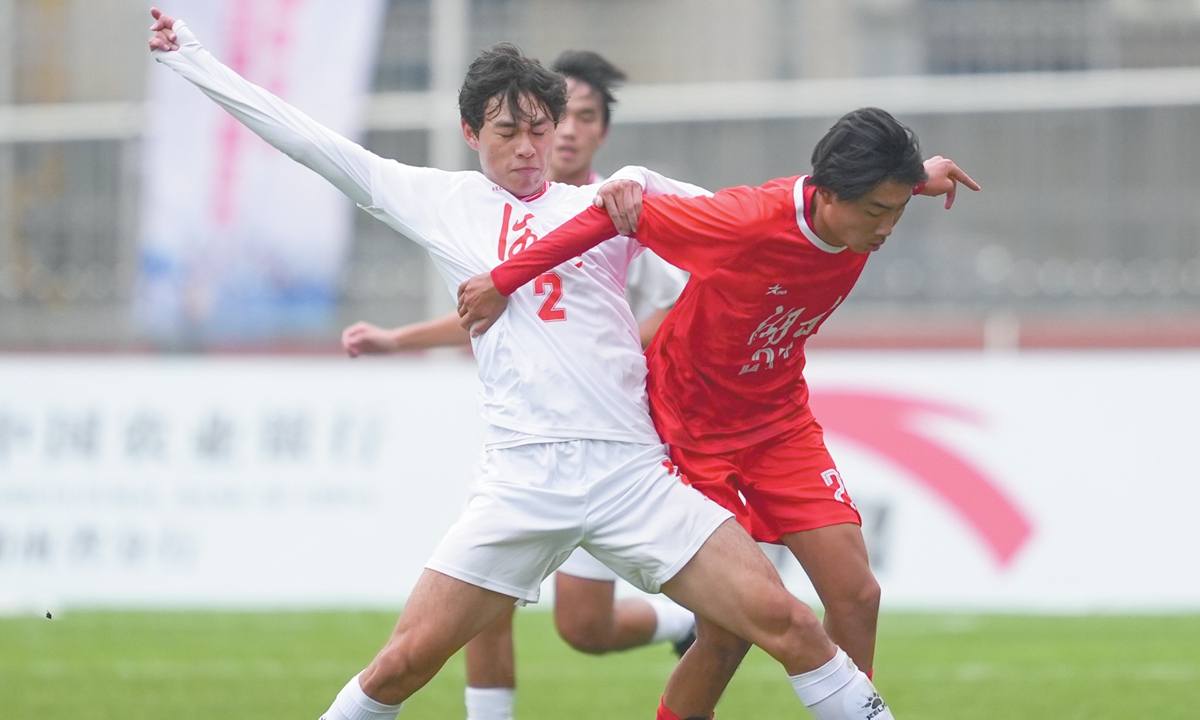 Two football players at the First National Youth Games for Football, Basketball, and Volleyball of China 