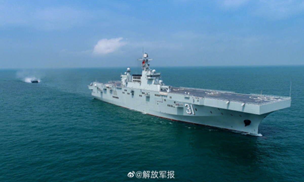 The amphibious assault ship Hainan attached to a landing ship detachment affiliated with the navy of the Chinese People's Liberation Army (PLA) Southern Theater Command participates in a maritime combat exercise at an undisclosed area in the South China Sea in early 2023. Photo: Screenshot from the Weibo account of the PLA Daily