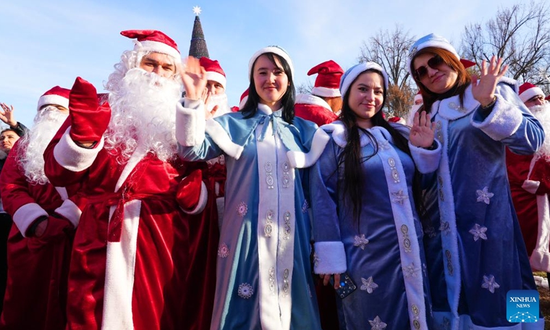 People dressed in costumes celebrate festivals in Tashkent, Uzbekistan, Dec. 25, 2024. (Photo by Zafar Khalilov/Xinhua)