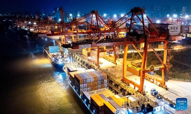 An aerial drone photo take on Dec. 20, 2024 shows a view of the Yangluo Port in Wuhan, central China's Hubei Province. Major ports on the Yangtze, China's longest river, are expected to post a total throughput of 4.02 billion tonnes of cargo this year, breaking the mark of 4 billion tonnes for the first time, according to navigation authorities. (Xinhua/Xiao Yijiu)