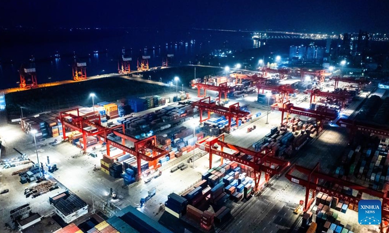 An aerial drone photo take on Dec. 20, 2024 shows a view of the Yangluo Port in Wuhan, central China's Hubei Province. Major ports on the Yangtze, China's longest river, are expected to post a total throughput of 4.02 billion tonnes of cargo this year, breaking the mark of 4 billion tonnes for the first time, according to navigation authorities. (Xinhua/Xiao Yijiu)