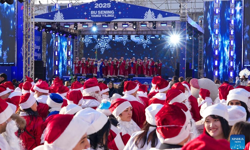 People dressed in costumes celebrate festivals in Tashkent, Uzbekistan, Dec. 25, 2024. (Photo by Zafar Khalilov/Xinhua)