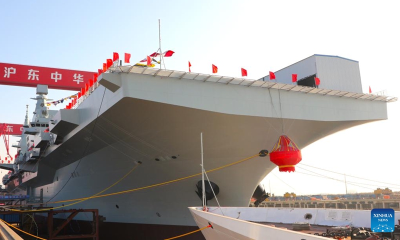 This photo shows China's first Type 076 new-generation amphibious assault ship, the <em>Sichuan</em>. China launched its first Type 076 new-generation amphibious assault ship, the <em>Sichuan</em>, in Shanghai on Friday. Named after southwest China's <em>Sichuan</em> Province, the independently-developed new vessel was put into the water at a launch and naming ceremony. It was given the hull number 51. (Xinhua/Li Yun)