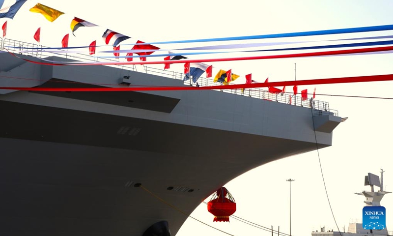 This photo shows China's first Type 076 new-generation amphibious assault ship, the Sichuan. China launched its first Type 076 new-generation amphibious assault ship, the Sichuan, in Shanghai on Friday. Named after southwest China's Sichuan Province, the independently-developed new vessel was put into the water at a launch and naming ceremony. It was given the hull number 51. (Xinhua/Li Yun)