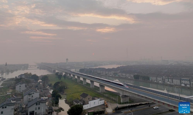 A train running along the Shanghai-Suzhou-Huzhou high-speed railway, in Suzhou, east China's Jiangsu Province, Dec. 26, 2024.