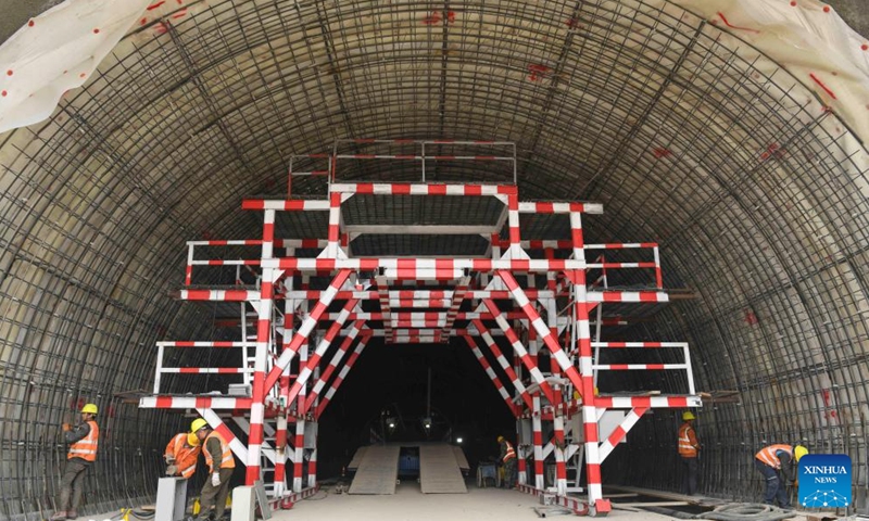 Workers operate at the construction site of Tianshan Shengli tunnel along the expressway linking Urumqi and Yuli County in northwest China's Xinjiang Uygur Autonomous Region, May 19, 2020.The 22.13-km Tianshan Shengli tunnel, world's longest expressway tunnel, will soon be drilled through. (Xinhua/Hu Huhu)