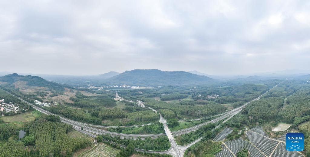 An aerial drone photo taken on Dec. 29, 2024 shows the Qiongzhong section of a ring road surrounding the national tropical rain forest park in south China's Hainan Province.