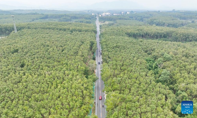 An aerial drone photo taken on Dec. 29, 2024 shows the Qiongzhong section of a ring road surrounding the national tropical rain forest park in south China's Hainan Province.