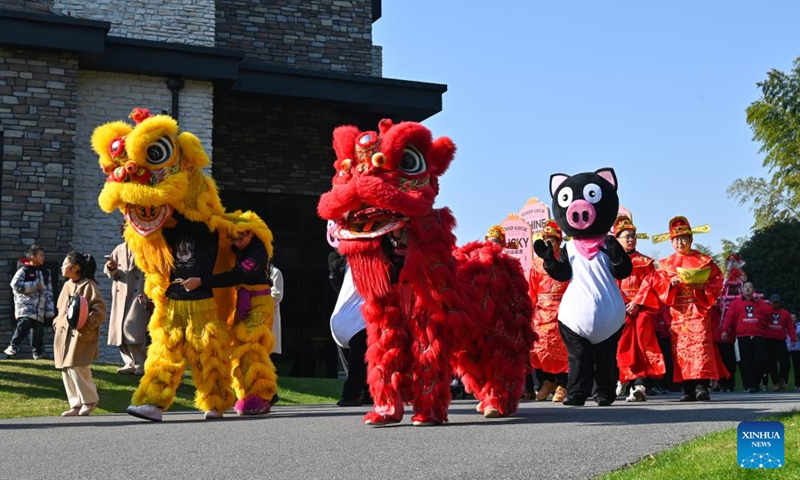 A cultural parade is held in Wucheng District, Jinhua, east China's Zhejiang Province, Dec. 29, 2024. China is gearing up for the upcoming New Year 2025 with festive decorations and various activities nationwide. (Photo by Hu Xiaofei/Xinhua)