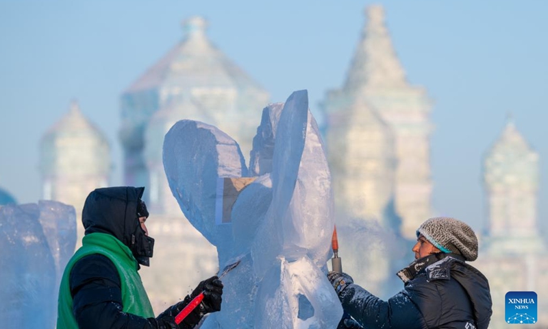 Competitors work on an ice sculpture during the 36th China Harbin International Ice Sculpture Competition at Harbin Ice-Snow World in Harbin, northeast China's Heilongjiang Province, Jan. 3, 2025. A total of 30 teams from 12 countries and regions participated in the competition. (Xinhua/Zhang Tao)