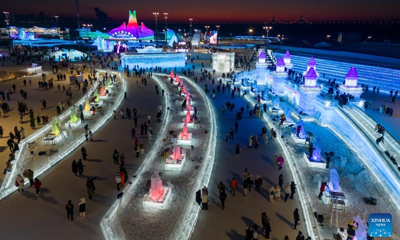 In this aerial drone photo, competitors work on ice sculptures during the 36th China Harbin International Ice Sculpture Competition at Harbin Ice-Snow World in Harbin, northeast China's Heilongjiang Province, Jan. 3, 2025. A total of 30 teams from 12 countries and regions participated in the competition. (Xinhua/Zhang Tao)