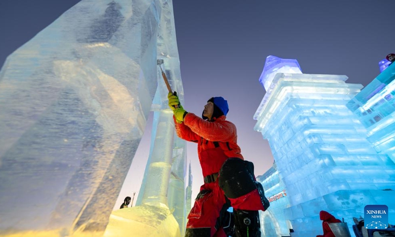 A competitor works on an ice sculpture during the 36th China Harbin International Ice Sculpture Competition at Harbin Ice-Snow World in Harbin, northeast China's Heilongjiang Province, Jan. 3, 2025. A total of 30 teams from 12 countries and regions participated in the competition. (Xinhua/Zhang Tao)