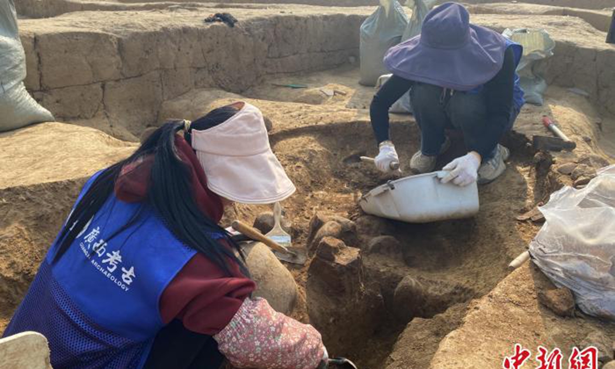 Staff members work on excavation at the Niuluchong site in Gucheng village, Guilin, South China's Guangxi Zhuang Autonomous Region. Photo: chinanews.com.cn 