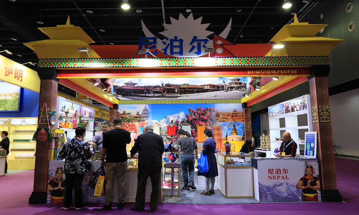 Visitors browse and select items at the Nepalese imports booth during the 2024 China Yiwu International Commodities Fair - Export Goods Exhibition on November 13, 2024. Photo: VCG