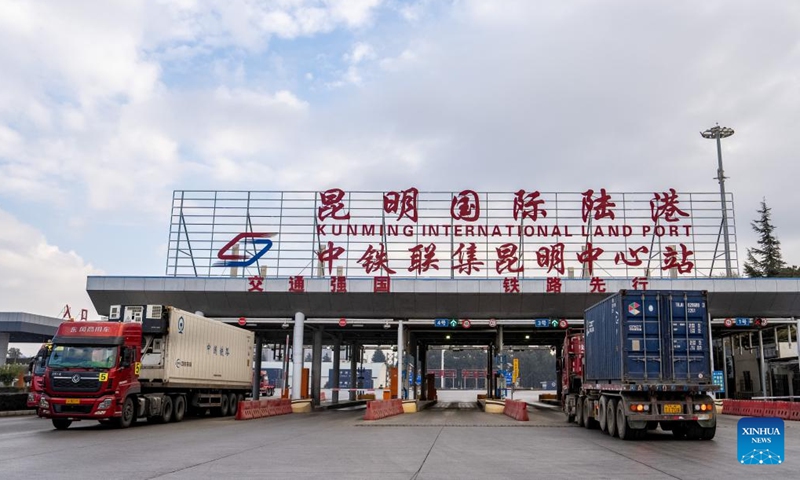 Trucks transport railway containers at the Kunming cargo terminal of China United International Rail Containers Co., Ltd. (CRIntermodal) in Kunming, southwest China's Yunnan Province, on Jan. 2, 2025. Since the full operation of the China-Laos Railway on Dec. 3, 2021, the total cargo throughput of the railway has exceeded 50 million tons, including 11.58 million tons of cross-border goods. (Xinhua/Hu Chao)