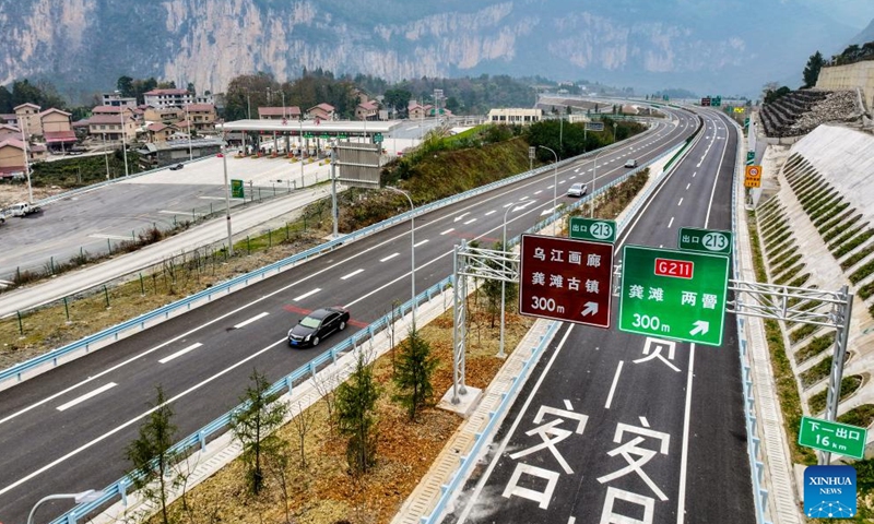 This aerial drone photo taken on Jan. 2, 2025 shows vehicles running on the second expressway connecting southwest China's Chongqing Municipality and central China's Hunan Province. The second Chongqing-Hunan expressway saw its 127-km Banan-Wulong section and 91.6-km Pengshui-Youyang section, both in Chongqing, opened to public traffic on Thursday. The whole expressway, with a length of 280 kilometers, is expected to put in full operation within 2025. (Xinhua/Tang Yi)