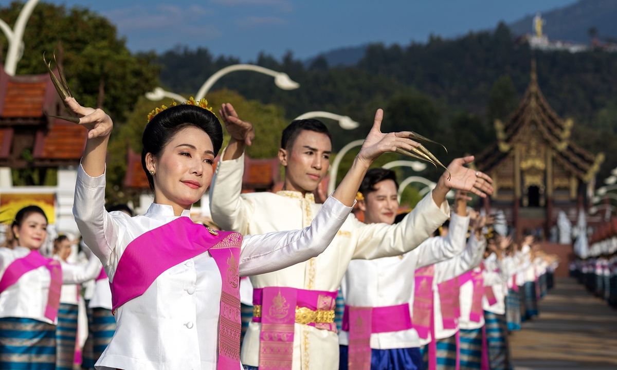 Thai performers in traditional attire perform the Thai Lanna 