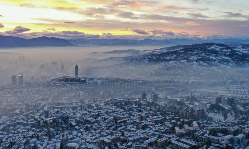 An aerial drone photo taken on Jan. 5, 2025 shows a winter view in Sarajevo, Bosnia and Herzegovina. Sarajevo is the capital and largest city of Bosnia and Herzegovina. Located in the east-central part of Bosnia and Herzegovina, it is situated in a hilly area, surrounded by mountains, with a population of about 300,000. (Xinhua/Yin Xiaosheng)