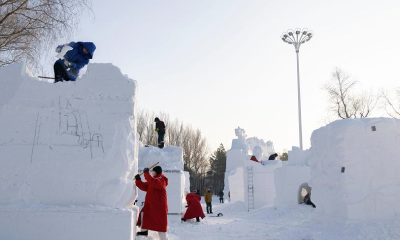 Contestants work on snow sculptures at the Sun Island International Snow Sculpture Art Expo park in Harbin, northeast China's Heilongjiang Province, Jan. 6, 2025. The 27th Harbin international snow sculpture competition kicked off on Monday, attracting snow sculptors of more than 20 teams from 10 countries. (Xinhua/Xie Jianfei)