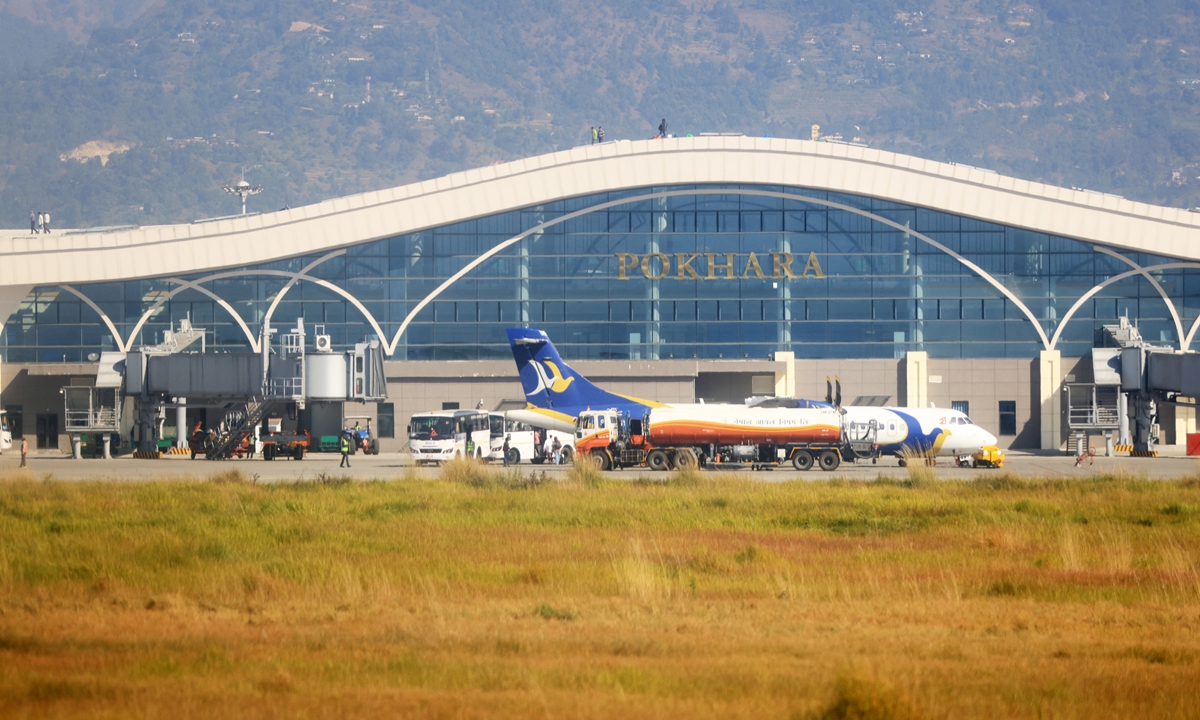 A plane lands at the Pokhara International Airport constructed by a Chinese company in Pokhara, Nepal. Photo: VCG