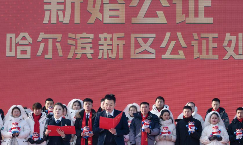 Loving couples take part in a group wedding at the Harbin Ice-Snow World in Harbin, northeast China's Heilongjiang Province, Jan. 6, 2025. A free group wedding which is part of the Harbin International Ice and Snow Festival was held at the Harbin Ice-Snow World on Monday. The winter-themed event was participated by 43 couples from 17 provinces, municipalities or regions in China. (Xinhua/Zhang Tao)