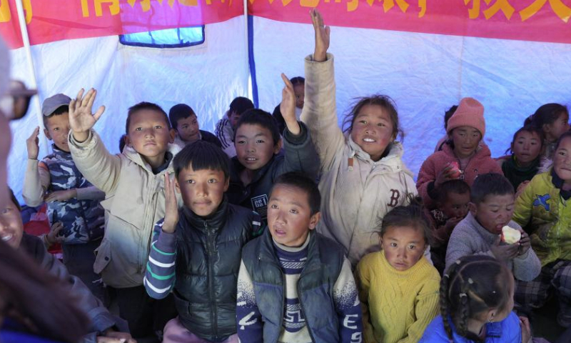 Children raise hands to answer questions during a psychology class given by a social work service center at a resettlement site of quake-affected residents in a village in Dingri County in Xigaze, southwest China's Xizang Autonomous Region, Jan. 8, 2025.

The search-and-rescue effort has entered its final stage after a 6.8-magnitude earthquake struck Dingri County in southwest China's Xizang Autonomous Region on Tuesday morning, the regional government said on Wednesday.

The focus of work has shifted to the resettlement of quake-affected residents and post-disaster reconstruction, said Hong Li, head of the regional emergency management department at a press conference. (Xinhua/Jigme Dorje)